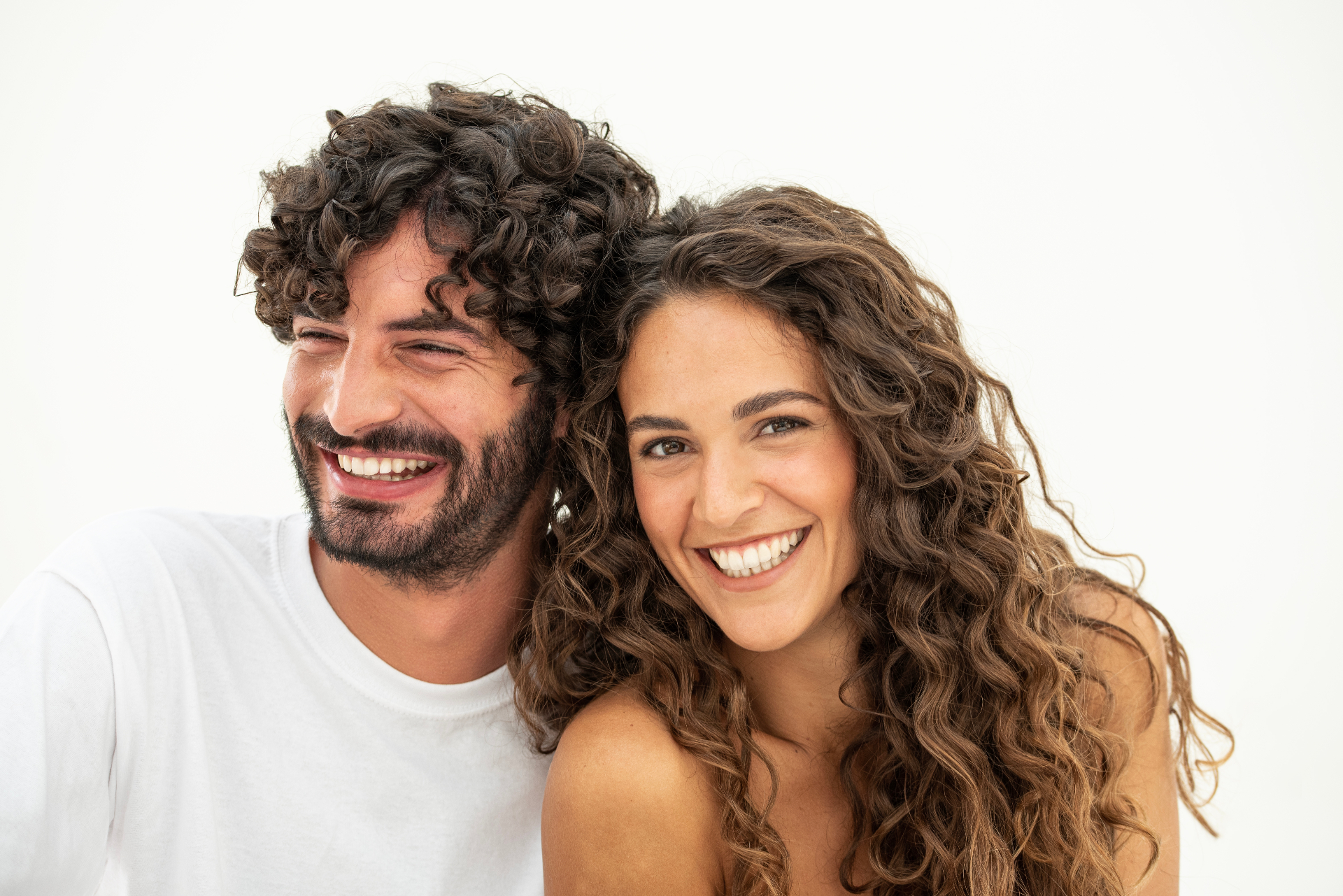 Smiling couple with healthy natural hair