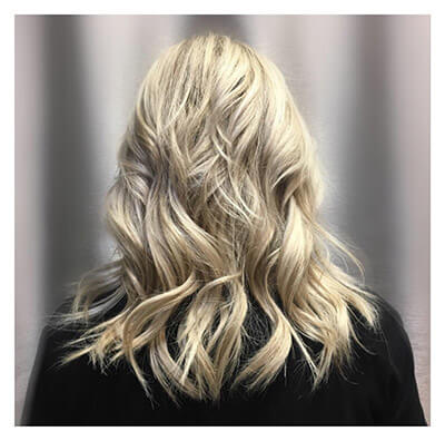 Blonde woman after hair extensions