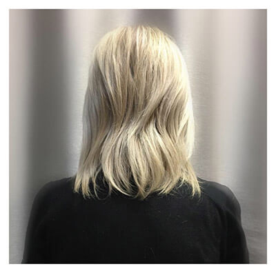 Blonde woman before hair extensions